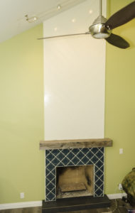 Decorative Ceramac tile, shiplap chevron pattern and a gas open fireplace