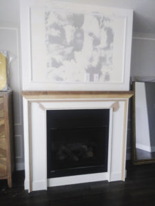 36 inch gas fireplace with layered wood trim, alder stained mantel